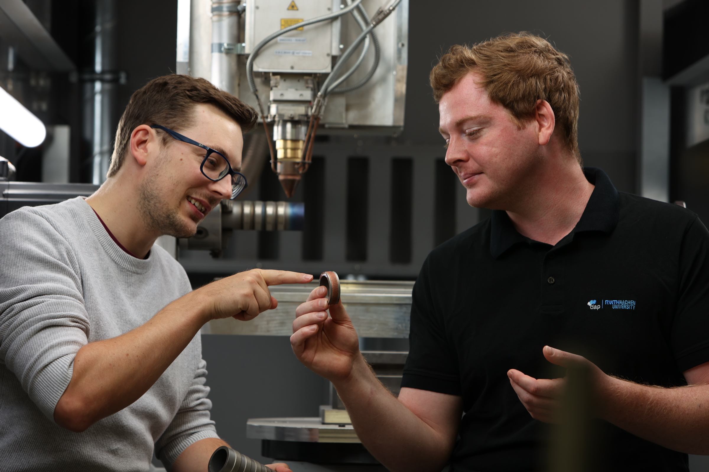 IamDAP: Sebastian Bold and colleague looking at 3D printed part